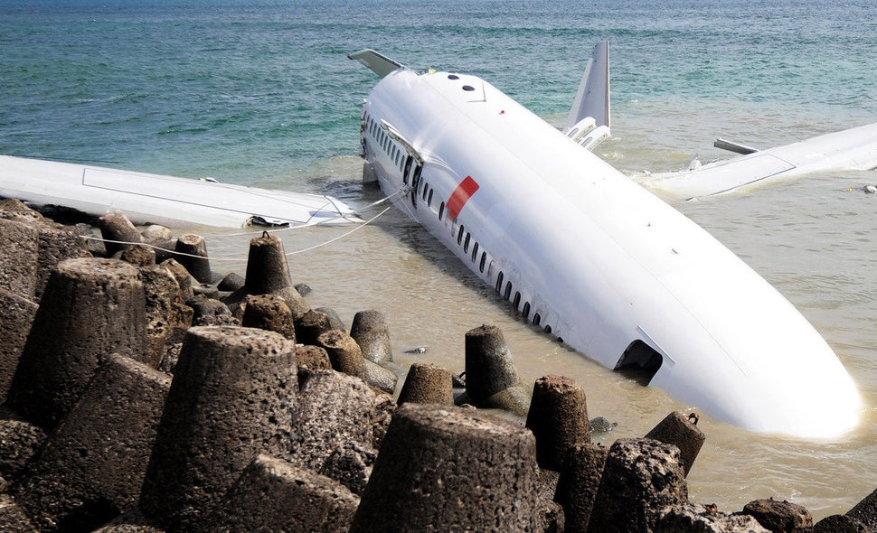 A Lion Air Boeing 737 lies partially submerged in the water two days after it crashed while trying to land at Bali's internat