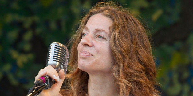 NEW ORLEANS, LA - MAY 06: Singer-songwriter Ani DiFranco performs on stage for the Preservation Hall and Friends 50th Anniversary Celebration during the 2012 New Orleans Jazz & Heritage Festival at the Fair Grounds Race Course on May 6, 2012 in New Orleans, Louisiana. (Photo by Skip Bolen/WireImage)