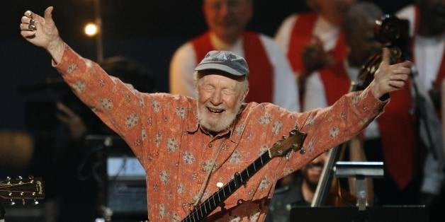 Folk music legend Pete Seeger acknowledges the crowd during a concert marking his 90th birthday at Madison Square Garden in New York onMay 3, 2009. Proceeds from the show will go to Hudson River Sloop Clearwater, an organization founded by the singer 40 years ago to preserve and protect the Hudson River. AFP PHOTO/TIMOTHY A. CLARY (Photo credit should read TIMOTHY A. CLARY/AFP/Getty Images)