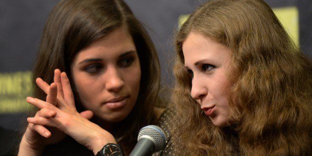 Nadezhda Tolokonnikova (L) and Maria Alyokhina of Russian punk protest group Pussy Riot attend the Amnesty International Concert presented by the CBGB Festival at Barclays Center on February 5, 2014 in New York City. AFP PHOTO/Don Emmert (Photo credit should read DON EMMERT/AFP/Getty Images)