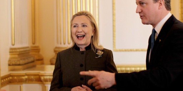 LONDON - FEBRUARY 23: British Prime Minister David Cameron talks to U.S. Secretary of State Hillary Clinton during the Somalia Conference at Lancaster House on February 23, 2012 in London, United Kingdom. Britain's Prime Minister David Cameron has invited US Secretary Of State Hilary Clinton, UN Secretary General Ban Ki Moon and representatives from over 40 governments to participate in the London Conference on Somalia, to discuss the rebuilding of Somalia and the tackling of piracy, terrorism and famine. (Photo by Matt Dunham/WPA Pool/Getty Images)