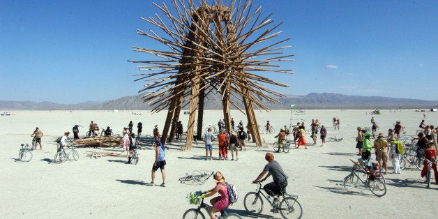 An art installation called Bamboo Spire, A 50-foot tall bamboo sculpture, stands on the playa Wednesday, Aug. 31, 2006, at Burning Man during the weeklong 20th annual art festival in the Nevada's Black Rock Desert. (AP Photo/Ron Lewis)