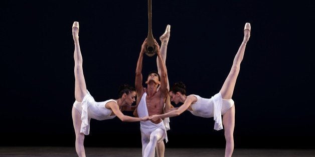 Renan Cerdeiro, center, dances during a dress rehearsal for the Miami City Ballet's performance of Apollo, Thursday, Oct. 18, 2012, in Miami. The Miami City Ballet opens its season Friday. (AP Photo/Lynne Sladky)