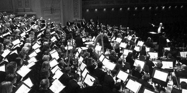 Robert Spano leading the Atlanta Symphony Orchestra in Britten's 'War Requiem' at Carnegie Hall on Wednesday night, April 30, 2014.(Photo by Hiroyuki Ito/Getty Images)