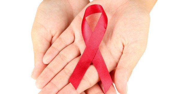 aids ribbon in hands isolated...