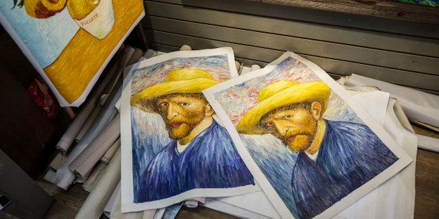 SHENZHEN, CHINA - JUNE 12: On the floor of the Impression Gallery lie several versions of some of Van Gogh's most famous works, for sale at the artist village on June 12, 2014 in Shenzhen, China. The Dafen Artist Village in Guangdong province, China, is home to thousands of artists who reproduce some of the world's most iconic paintings as well as create their own works. The village, on the outskirts of Shenzhen, is becoming a major center for original Chinese art. (Photo by Palani Mohan/Getty images)