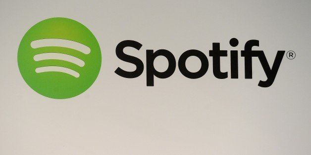 A Spotify logo is seen as founder and CEO Daniel Ek addresses a press conference in New York, December 11, 2013. The music streaming service, Spotify, unveiled a new ad-based service for mobile and tablet users that will allow access to Spotify's song catalog for free. Ek also announced, that the Spotify catalog will now include the works of Led Zeppelin, the legendary band that until this deal had withheld its music from streaming services. AFP PHOTO/Emmanuel Dunand (Photo credit should read EMMANUEL DUNAND/AFP/Getty Images)