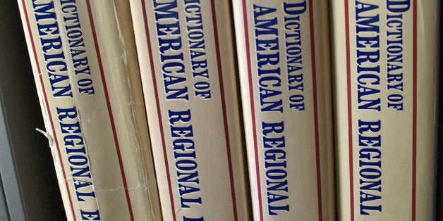 In this March 3, 2009 file photo are volumes 1 through 4 of the Dictionary of American Regional English in the office of dictionary editor Joan Houston Hall in Madison, Wis. The first of five print volumes that records the different ways people across America talk came out in 1985 with the final one released last year. (AP Photo/Carrie Antlfinger, File)