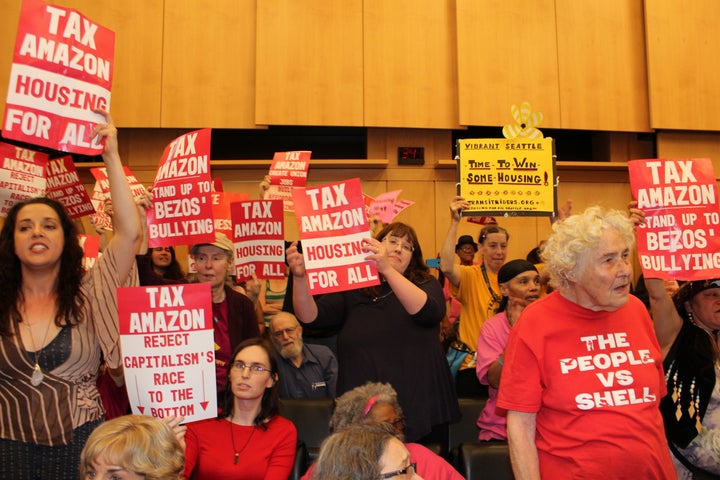 A Seattle City Council debate over the Employee Head Tax, a fee for large corporations that was repealed under threat of a ballot initiative.