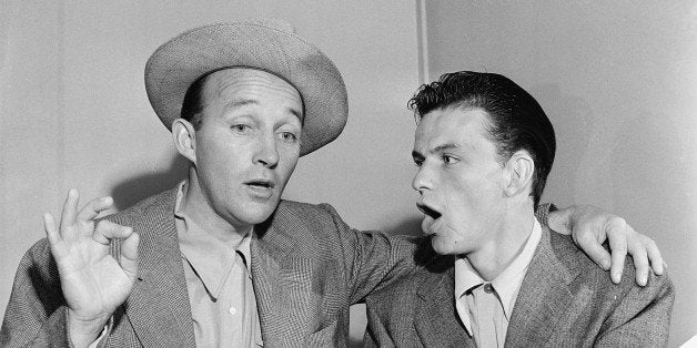 Bing Crosby, left, and Frank Sinatra break out in song in Bing's dressing room between radio programs in Hollywood, Ca., Sept