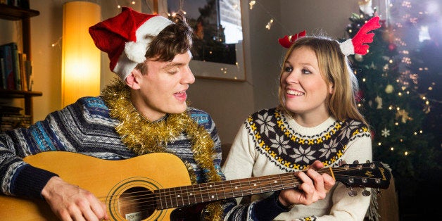 man sings Christmas songs for girlfriend.