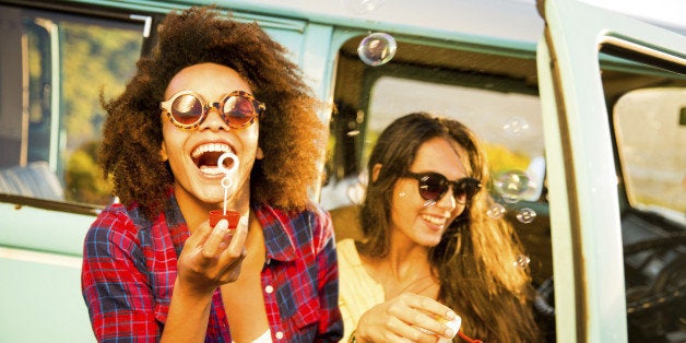 Friends blowing bubbles on roadtrip