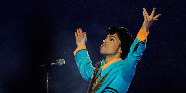 FILE- In this Feb. 4, 2007, file photo, Prince performs during the halftime show at Super Bowl XLI at Dolphin Stadium in Miam