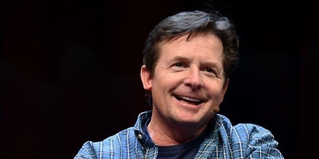 Michael J. Fox speaks to a crowd during a panel discussion about 'Back to the Future' during the Silicon Valley Comic Con in San Jose, California on March 19, 2016. The comic and entertainment-themed event features exhibits, panel discussions and pop culture artistry. Fox starred in the 1985 US science-fiction adventure comedy film 'Back to the Future.' / AFP / JOSH EDELSON (Photo credit should read JOSH EDELSON/AFP/Getty Images)