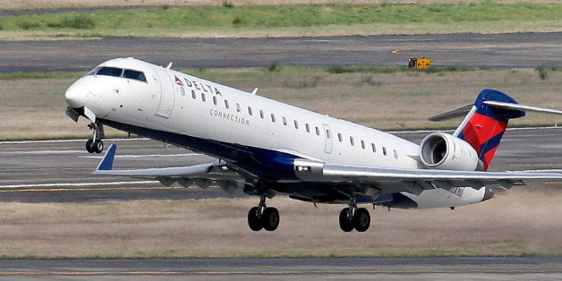 FILE - In this March 24, 2015 file photo, a Delta jet takes off from Seattle-Tacoma International Airport in SeaTac, Wash. The U.S. Department of Transportation on Thursday, Oct. 8, 2015 said that the nation's leading carriers posted an on-time rate of 80.3 percent in August. Delta Air Lines had the best on-time rate at 85.5 percent. (AP Photo/Elaine Thompson, File)