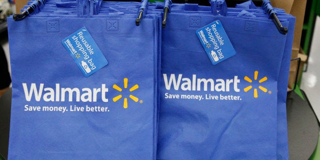 FILE - In this Thursday, Sept. 19, 2013, file photo, reusable shopping bags are offered for sale at a Wal-Mart Neighborhood Market, in the Chinatown district of Los Angeles. Wal-Mart is sharpening its attack against Amazon. The discounter says it is changing its membership-based free shipping service test to two days from three days and is charging one dollar less for the annual membership fee. Wal-Mart began testing the service in 2015 as a way to counter Amazonâs highly successful Prime shipping. (AP Photo/Nick Ut, File)