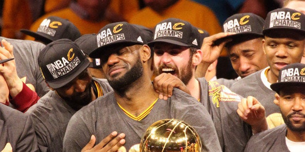 OAKLAND, CA - JUNE 19: LeBron James #23 of the Cleveland Cavaliers holds up the Larry O'Brien Trophy after the 2016 NBA Fina