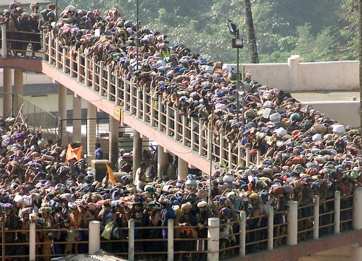 Hindu pilgrims line up at the Sabarimala Temple to offer prayers to the Hindu deity Ayappa in 2003.