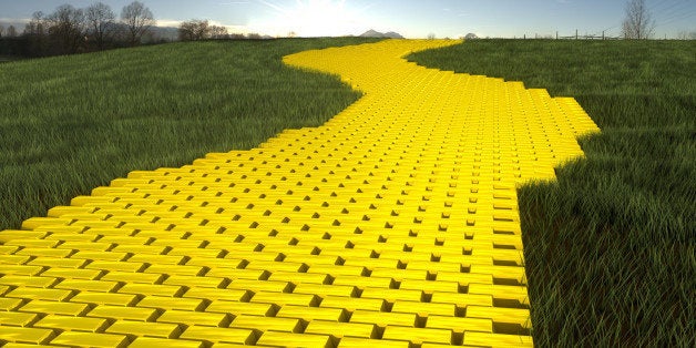 Gold ingod road in grass with sky