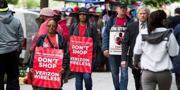 WASHINGTON, USA - MAY 18: Verizon workers on strike march outside of a Verizon Wireless store in downtown Washington, USA on