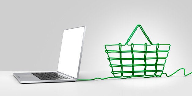 Laptop computer with green ethernet cable forming a shopping basket, coming out of the back on a plain background