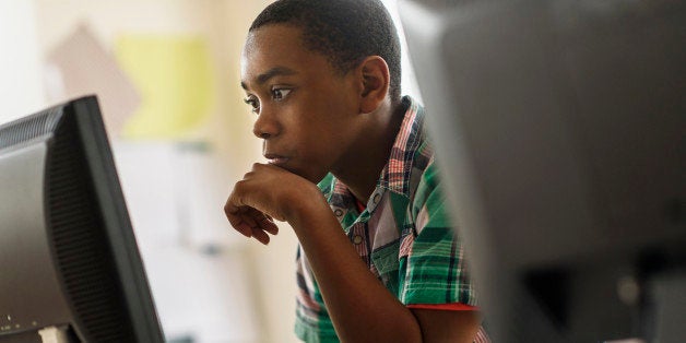 Black students using computers in classroom