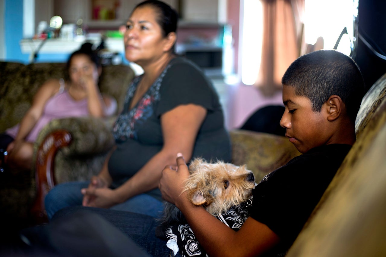 Cesar at his Townsend Street apartment with his mom, Kenia Gaspar (center), and sister, Nadia, shortly before his August juvenile court hearing.