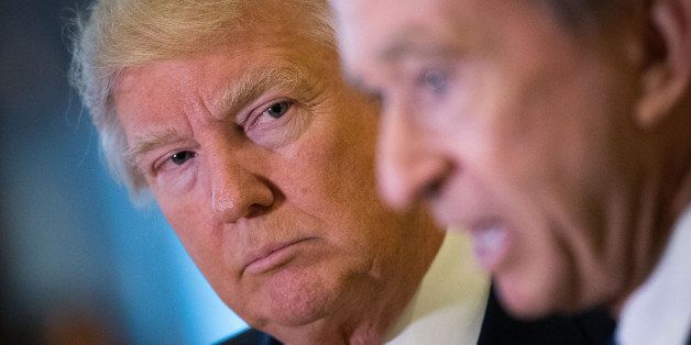 NEW YORK, NY - JANUARY 9: (L to R) President-elect Donald Trump looks on as French businessman Bernard Arnault, chief executive officer of LVMH, speak to reporters at Trump Tower, January 9, 2017 in New York City. President-elect Donald Trump and his transition team are in the process of filling cabinet and other high level positions for the new administration. (Photo by Drew Angerer/Getty Images)