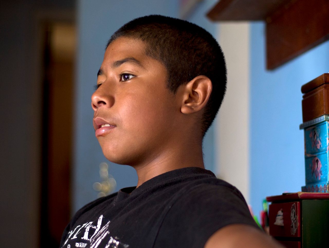Cesar, 13, in his Santa Ana apartment shortly before his August 2018 juvenile court hearing.