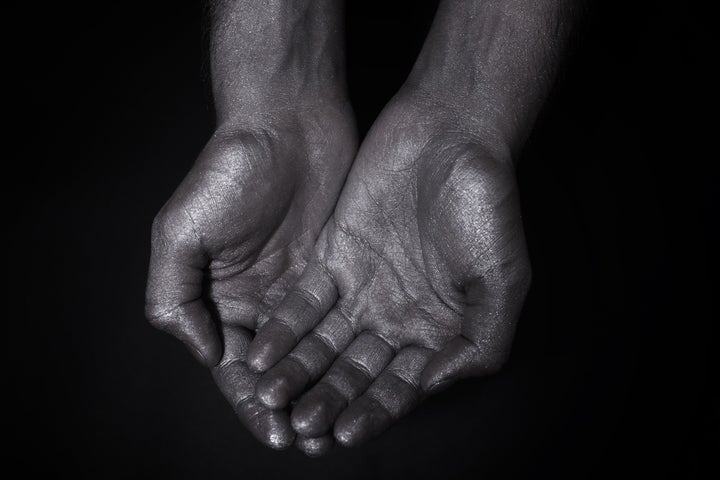 two hands folded a handful on a ...