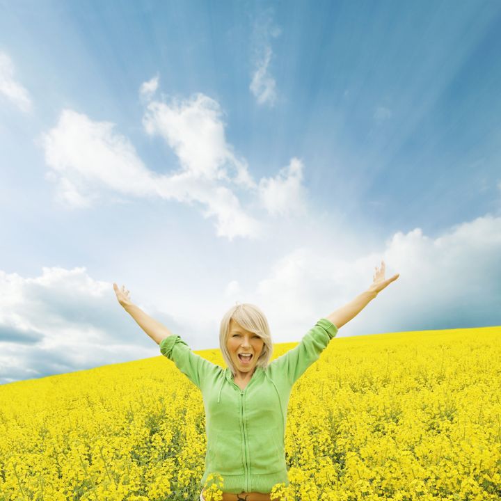 happy girl in a yellow field