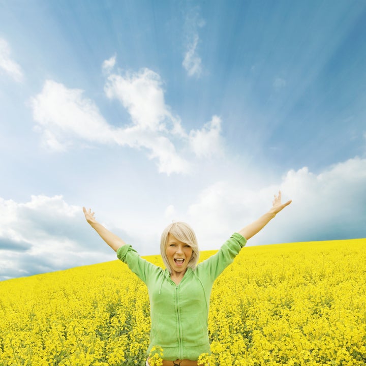 happy girl in a yellow field