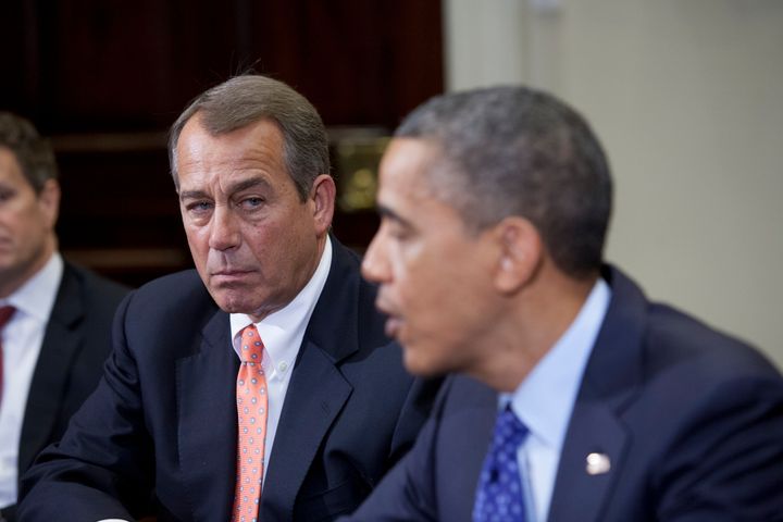 Speaker John Boehner (R-OH) listens to President Barack Obama speak before a budget meeting at the White House with other cabinet members on November 16, 2012 in Washington,DC. Obama said Friday that Democrats and Republicans needed to make 'tough compromises' in order to overcome divisions over deficit reduction and avoid the fiscal cliff. AFP PHOTO/TOBY JORRIN (Photo credit should read TOBY JORRIN/AFP/Getty Images)