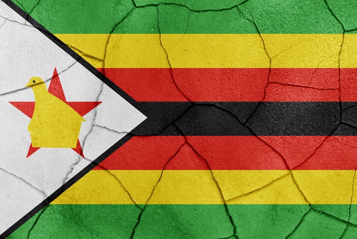 the zimbabwe flag painted on a...