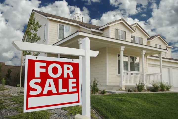 Home For Sale Sign in Front of Beautiful New Home