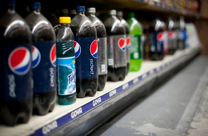 NEW YORK, NY - MARCH 11: Large soda bottles are seen in a bodega in Chinatown March 11, 2013 New York City. Today a New York state judge halted a controversial ban on large sugary drinks in places that serve prepared food that was to take effect tomorrow. (Photo by Allison Joyce/Getty Images)