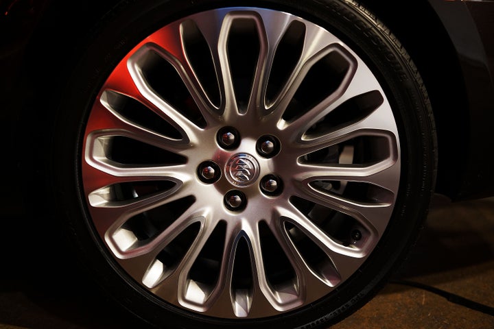 NEW YORK, NY - MARCH 26: A wheel on the new 2014 Buick LaCrosse is displayed at a launch party for new versions of General Motors Company (GM) Buick brand cars on March 26, 2013 in New York City. The new full-size LaCrosse offers new exterior design, advanced safety technologies and enhanced in-vehicle connectivity. GM released two new versions of the Regal midsize sports sedan and the LaCrosse large luxury car that the car company hopes will appeal to younger drivers. The New York International Auto Show opens to the media tomorrow. (Photo by Spencer Platt/Getty Images)