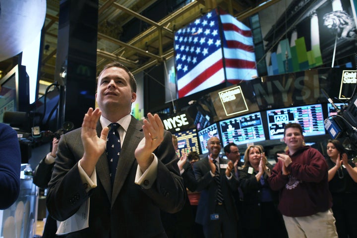 NEW YORK, NY - MARCH 25: Traders work the floor of the New York Stock Exchange during late trading on March 25, 2013 in New York City. The Dow Jones Industrial Average closed down 64 points amid renewed worries about Cyprus. (Photo by John Moore/Getty Images)