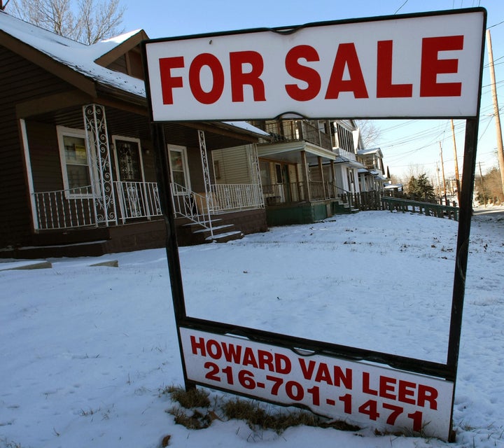 The front of a boarded up building in the Mount Pleasant section of Cleveland, Ohio, 25 January 2008. The area is filled with homes for sale or on the auction block. The city of Cleveland is the epicenter of the nation's home foreclosure crisis and is creating bad news for nearby homeowners and cities across the country because they lead to falling property values and increased crime. The mortgage crisis has created a new industry for developers buying foreclosed or auctioned homes at cheap prices, then reselling them for a profit. AFP PHOTO/Timothy A. CLARY (Photo credit should read TIMOTHY A. CLARY/AFP/Getty Images)