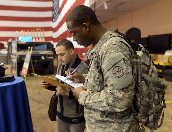 Soldiers fill out applications during the “Hiring Our Heroes – New York,” hiring fair for veterans and military spouses hosted by the New York Army National Guard at the 69th Regiment Armory March 27, 2013. The US Chamber of Commerce’s National Chamber Foundation, and lead sponsors Capital One Financial Corporation and Toyota, will celebrate the two-year anniversary of the Hiring Our Heroes program and more than 100 employers with jobs available for veterans and military spouses are at the fair . AFP PHOTO / TIMOTHY A. CLARY (Photo credit should read TIMOTHY A. CLARY/AFP/Getty Images)