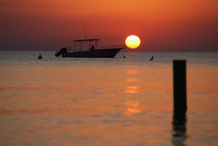 GEORGE TOWN, CAYMAN ISLANDS - APRIL 24: Sunset off Seven Mile Beach on 24 April, 2008 in Grand Cayman, Cayman Islands. (Photo by David Rogers/Getty Images)