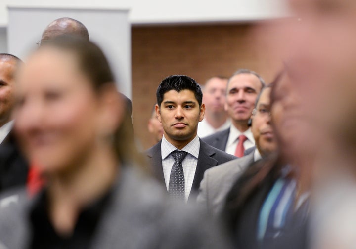 LOS ANGELES, CA - MARCH 20: Veterans listen to a speaker as they look for job openings at the University of Southern Califor
