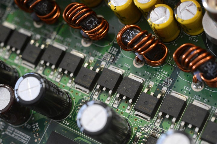 This picture taken on March 28, 2013 in Rennes, western France shows electronic circuits on a computer's motherboard. AFP PHO