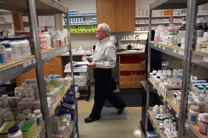 AURORA, CO - MARCH 27: Pharmacy director Hank Wedemeyer prepares to fill a prescription at a community health center on March 27, 2012 in Aurora, Colorado. The center, called the Metro Community Provider Network, has received some 6,000 more Medicaid eligable patients since the healthcare reform law was passed in 2010. Expansion of such clinics nationwide is considered key to serving the millions more patients set to be be covered by Medicaid if the healthcare reform passes the current challenge in the Supreme Court. Preventative health services and treatments at community health centers are also designed to reduce emergency room expenditures, which are up to 10 times more costly. (Photo by John Moore/Getty Images)