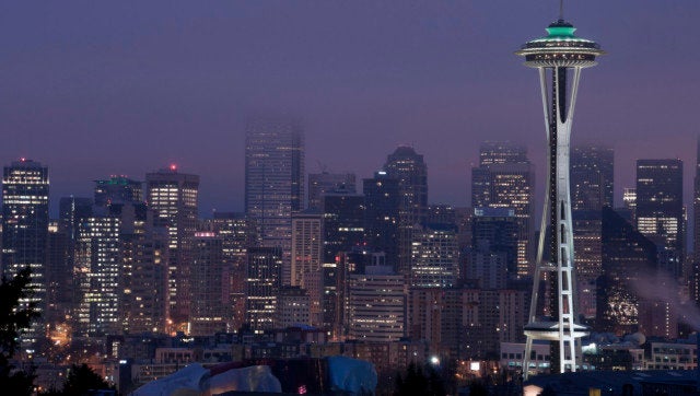 Foggy Seattle skyline at twilight just before sunrise.