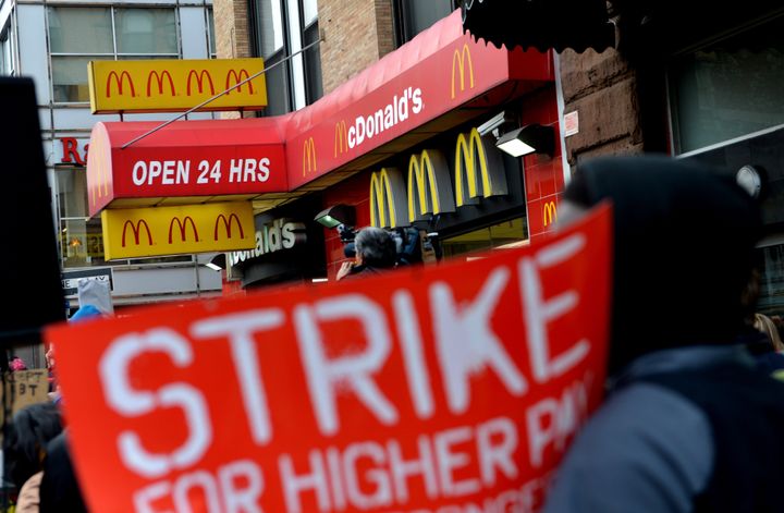 A coalition of groups rally in front of a McDonald's on East 125th Street and Lexington Avenue in Harlem during a protest by fast food workers and supporters for higher wages April 4, 2013 in New York. The protest was held on the 45th anniversary of the assasination of civil rights leader Martin Luther King, Jr. AFP PHOTO/Stan HONDA (Photo credit should read STAN HONDA/AFP/Getty Images)