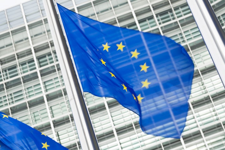 European Union flags in front of the Berlaymont building in Brussels, Belgium