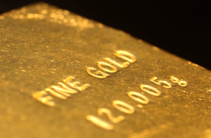 A gold bar is displayed at the Gold Expo held in J. Front Retailing Co.'s Matsuzakaya department store in Tokyo, Japan on Friday, April 12, 2013. Hedge funds and other speculators added to bullish gold bets as the metal slumped into a bearmarket and Goldman Sachs Group Inc. warned the retreat is accelerating after the longest rally in nine decades. Photographer: Yuriko Nakao/Bloomberg via Getty Images