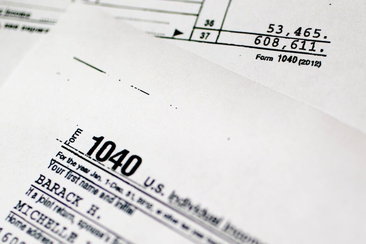 A copy of the U.S. Department of the Treasury Internal Revenue Service (IRS) 1040 Individual Income Tax form for the 2012 tax year belonging to U.S. President Barack Obama and first lady Michelle Obama is arranged for a photograph in Washington, D.C., U.S., on Friday, April 12, 2013. President Barack Obama and first lady Michelle Obama earned $608,611 in adjusted gross income in 2012, down 23 percent from 2011 as royalties from Obama's books continued to decline, tax returns released today showed. Photographer: Andrew Harrer/Bloomberg via Getty Images