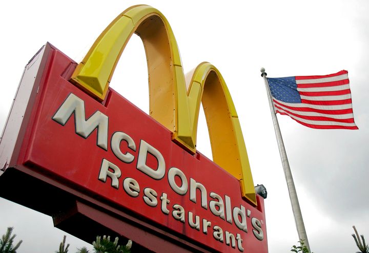 UNITED STATES - MAY 27: A U.S. flag flies outside a McDonald's restaurant in Park Ridge, Illinois, U.S., on Wednesday, May 27, 2009. McDonald's Corp., the world's largest restaurant company, said its locations in Russia and China are performing well amid the global economic decline. (Photo by Tim Boyle/Bloomberg via Getty Images)
